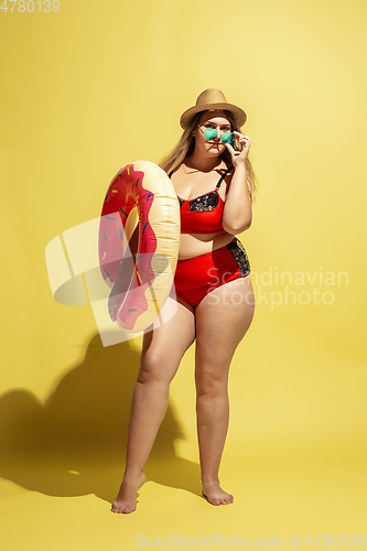 Image of Young caucasian plus size female model\'s preparing for beach resort