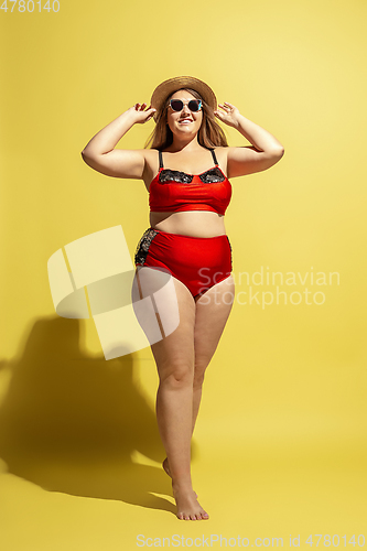 Image of Young caucasian plus size female model\'s preparing for beach resort