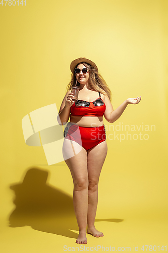 Image of Young caucasian plus size female model\'s preparing for beach resort