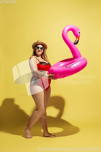 Image of Young caucasian plus size female model\'s preparing for beach resort