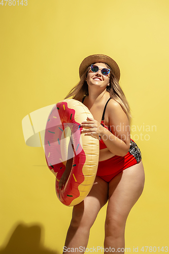 Image of Young caucasian plus size female model\'s preparing for beach resort