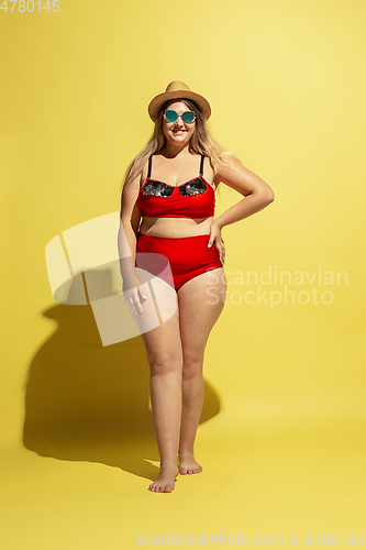 Image of Young caucasian plus size female model\'s preparing for beach resort