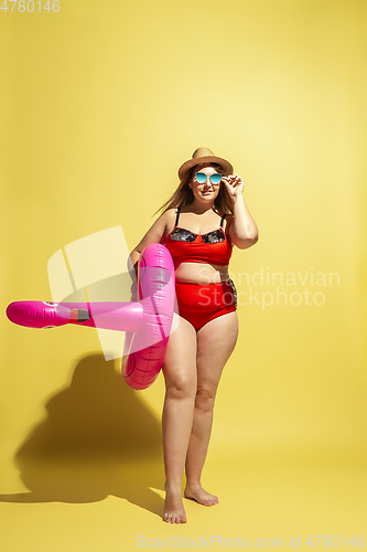 Image of Young caucasian plus size female model\'s preparing for beach resort