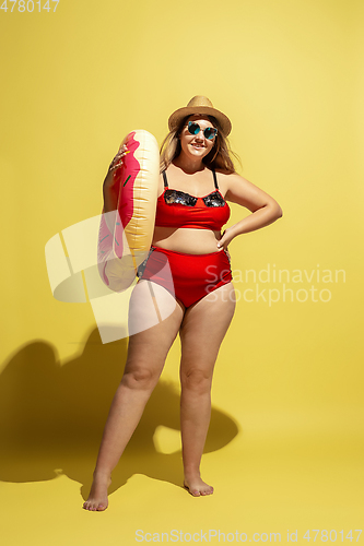 Image of Young caucasian plus size female model\'s preparing for beach resort