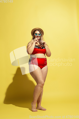 Image of Young caucasian plus size female model\'s preparing for beach resort