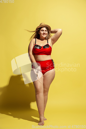 Image of Young caucasian plus size female model\'s preparing for beach resort