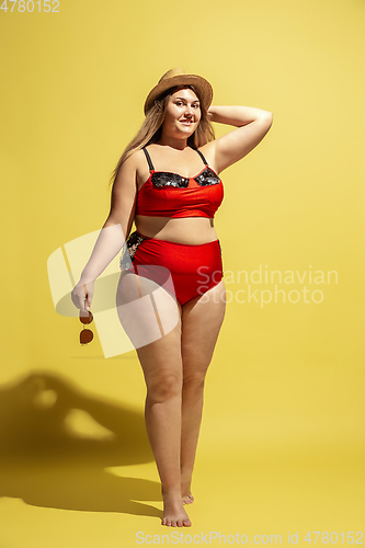 Image of Young caucasian plus size female model\'s preparing for beach resort