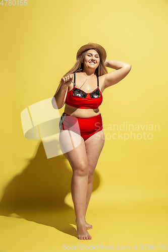 Image of Young caucasian plus size female model\'s preparing for beach resort