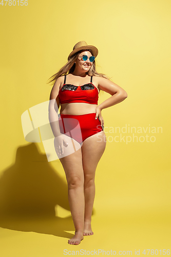Image of Young caucasian plus size female model\'s preparing for beach resort