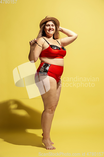 Image of Young caucasian plus size female model\'s preparing for beach resort