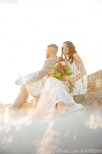 Image of Caucasian romantic young couple celebrating their marriage in city