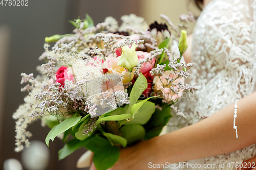 Image of Caucasian romantic young bride celebrating his marriage in city