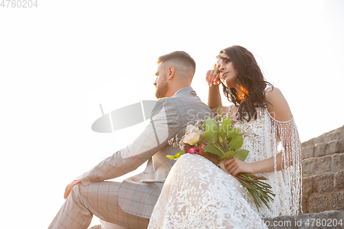 Image of Caucasian romantic young couple celebrating their marriage in city