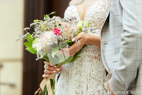 Image of Caucasian romantic young couple celebrating their marriage in city