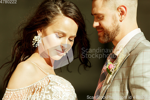 Image of Caucasian romantic young couple celebrating their marriage in city