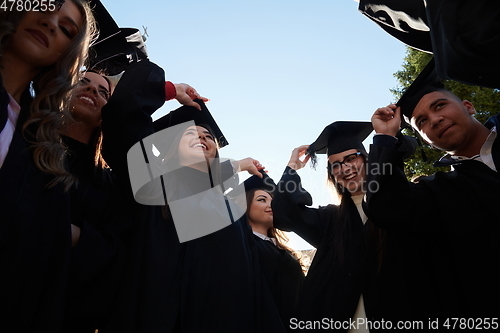 Image of Group of diverse international graduating students celebrating