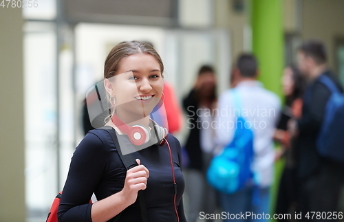 Image of famel student with modern technology in school