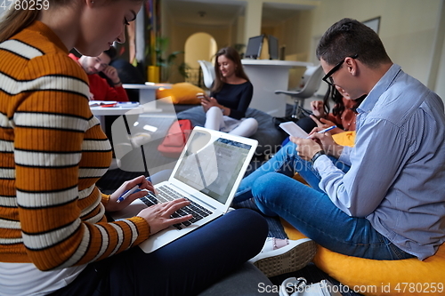 Image of students using modern technology for school project