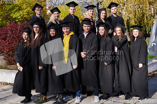 Image of Group of diverse international graduating students celebrating