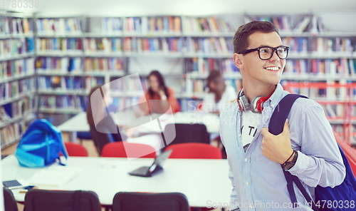 Image of the student uses a notebook, latop and a school library