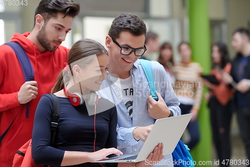 Image of students using modern technology for school project