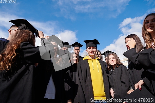 Image of Group of diverse international graduating students celebrating