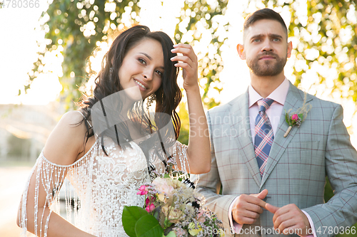 Image of Caucasian romantic young couple celebrating their marriage in city