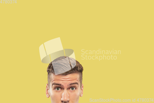 Image of Caucasian young man\'s close up shot on yellow background
