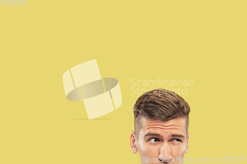 Image of Caucasian young man\'s close up shot on yellow background