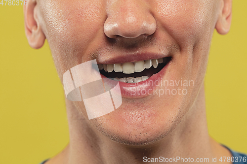 Image of Caucasian young man\'s close up shot on yellow background