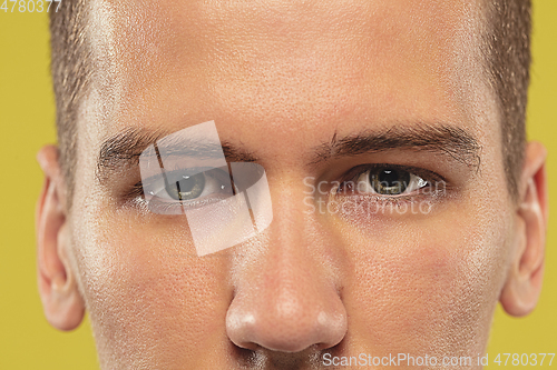 Image of Caucasian young man\'s close up shot on yellow background