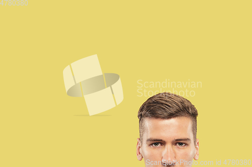 Image of Caucasian young man\'s close up shot on yellow background