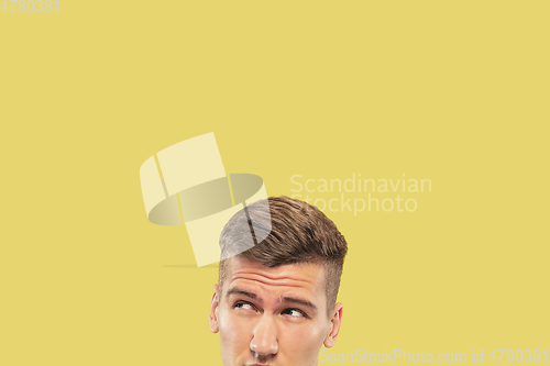 Image of Caucasian young man\'s close up shot on yellow background