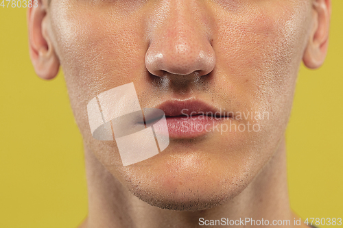 Image of Caucasian young man\'s close up shot on yellow background