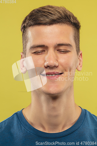 Image of Caucasian young man\'s close up shot on yellow background