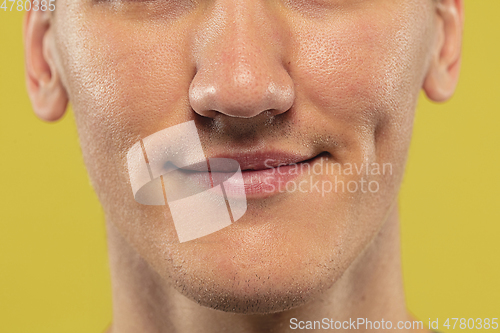 Image of Caucasian young man\'s close up shot on yellow background