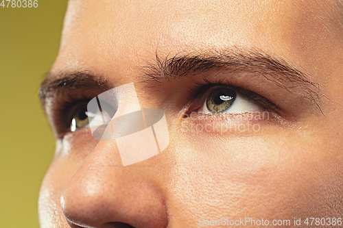 Image of Caucasian young man\'s close up shot on yellow background