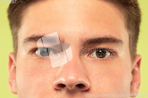 Image of Caucasian young man\'s close up shot on green background
