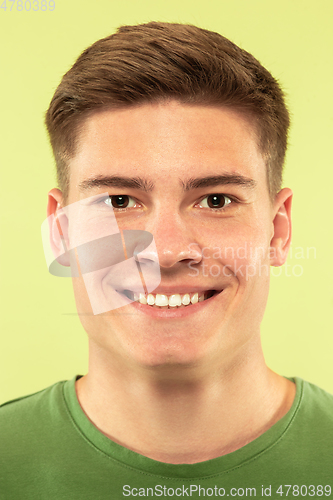 Image of Caucasian young man\'s close up shot on green background