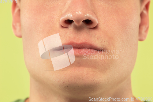 Image of Caucasian young man\'s close up shot on green background