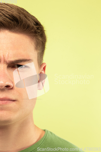 Image of Caucasian young man\'s close up shot on green background