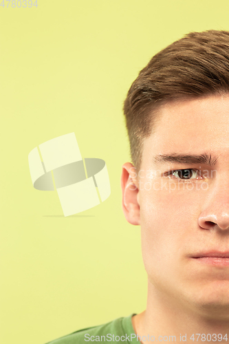 Image of Caucasian young man\'s close up shot on green background