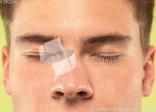 Image of Caucasian young man\'s close up shot on green background