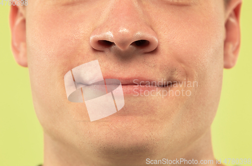 Image of Caucasian young man\'s close up shot on green background