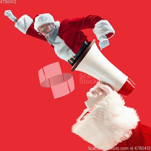 Image of Happy Christmas Santa Claus on studio background