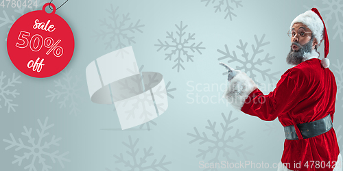 Image of Happy Christmas Santa Claus on studio background