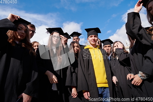 Image of Group of diverse international graduating students celebrating