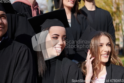 Image of Group of diverse international graduating students celebrating