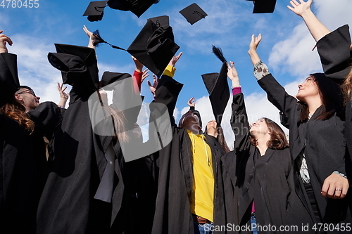 Image of Group of diverse international graduating students celebrating