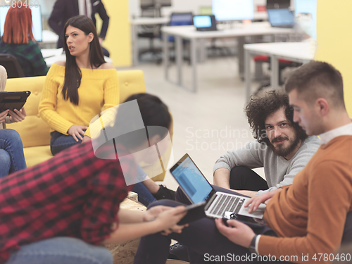 Image of team meeting and brainstorming in modern office